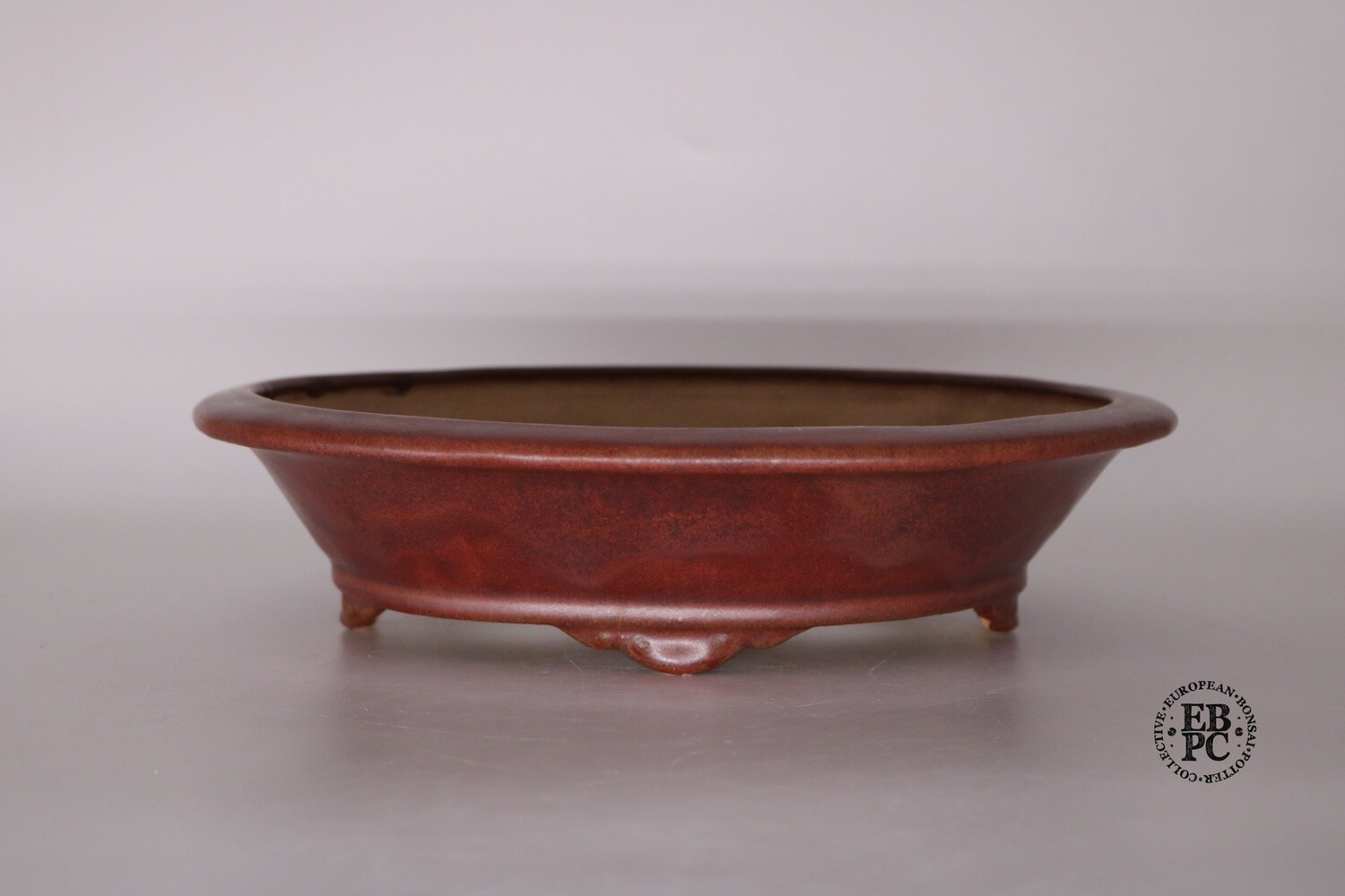 Fukurou Ceramics - Switzerland. 27.2cm; Hand-made; Oval; Formal Design; Lip to Rim; Basal Band; Cloud Feet; Glazed; Sang De Boeuf; Red; Patrik Lüthi.
