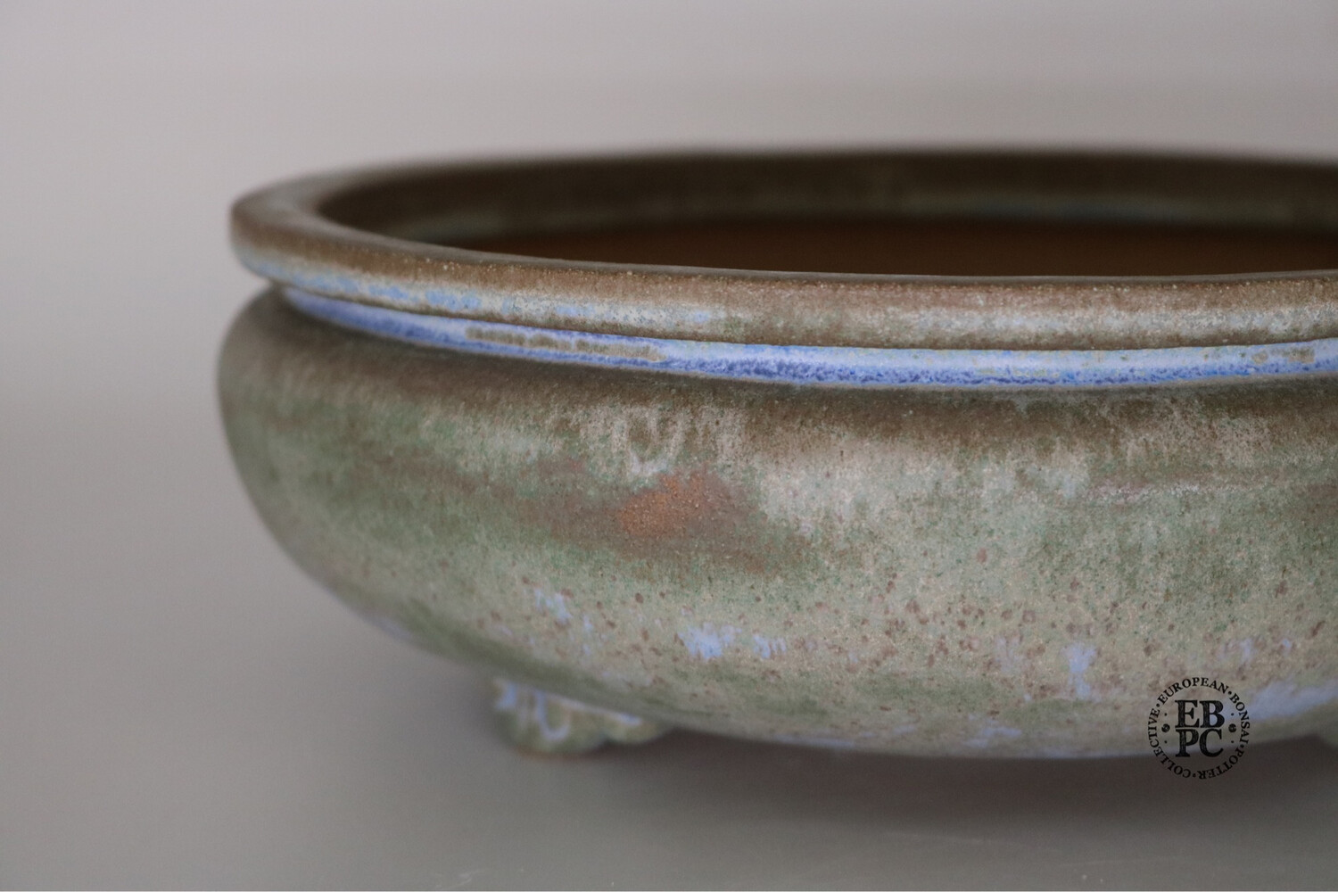 Fukurou Ceramics - Switzerland. 23.5cm; Hand-made; Round; 'Bag-style' Design (Fukuro-shiki) to Lip; Delicate Feet; Superb Glaze; Greens; Browns; Hints of Baby Blue; Patrik Lüthi