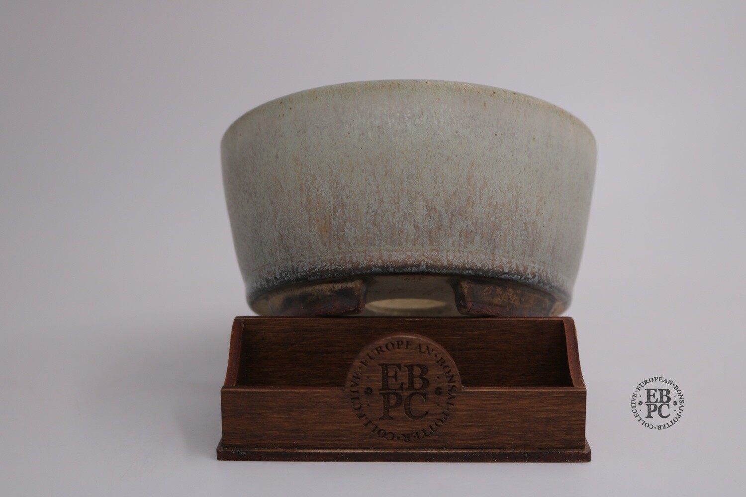 Ian Baillie - 15.2cm; Glazed; Round; Green; Cream; Brown; Aged looking glaze; Hand-signed; EBPC Stamped