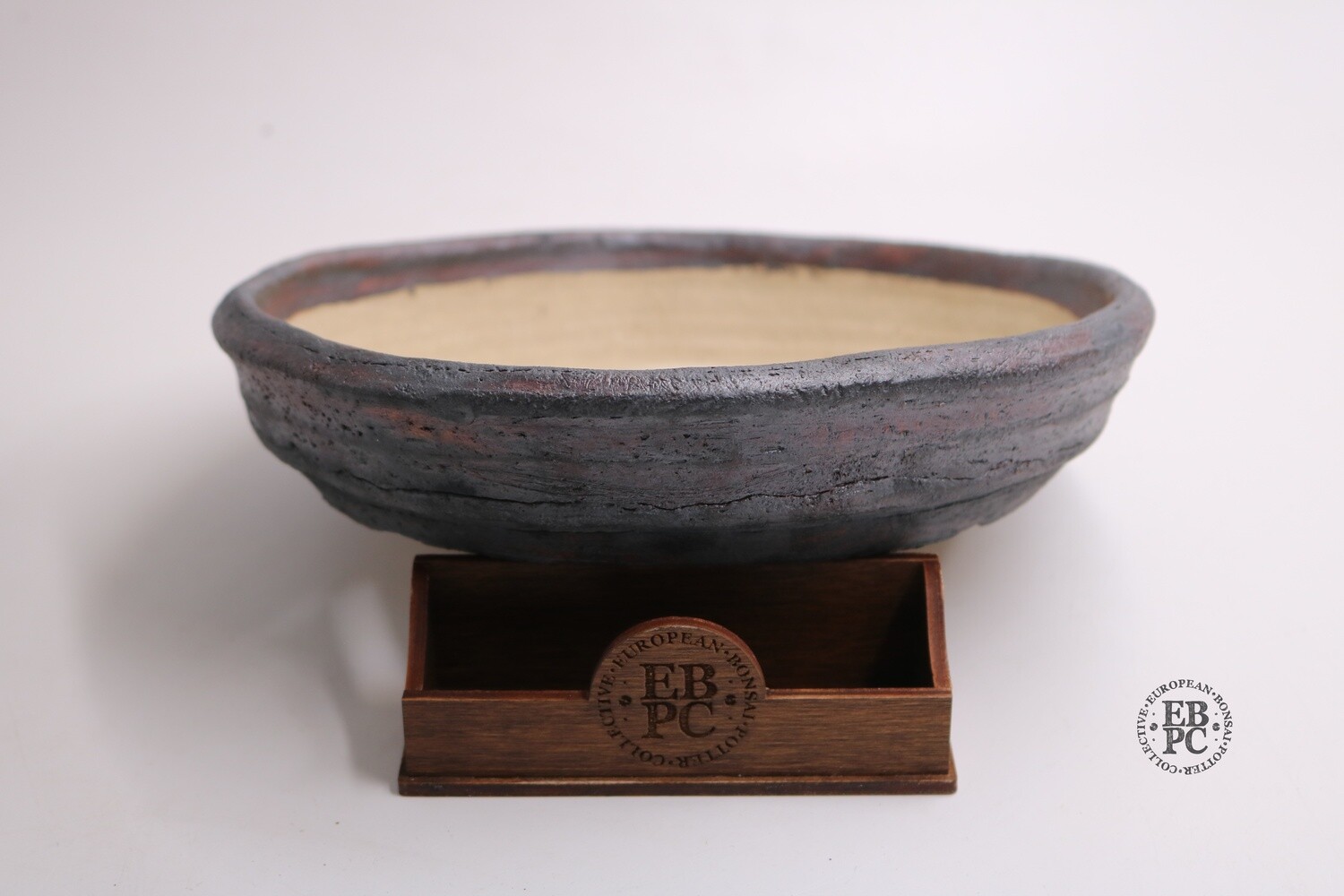 Ian Baillie - 24.2cm; Unglazed; Round; Nanban; Light Clay; Brown Oxide Finish; Rustic; Aged looking; Hand-signed; EBPC Stamped