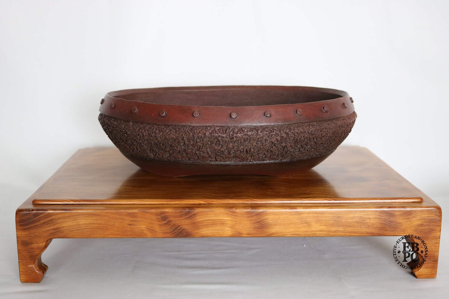 M. J. G. Ceramica - Unglazed; Oval; 26.7cm Textured Body, Rivets; Reddish-brown Clay; Maria Jose Gonzalez