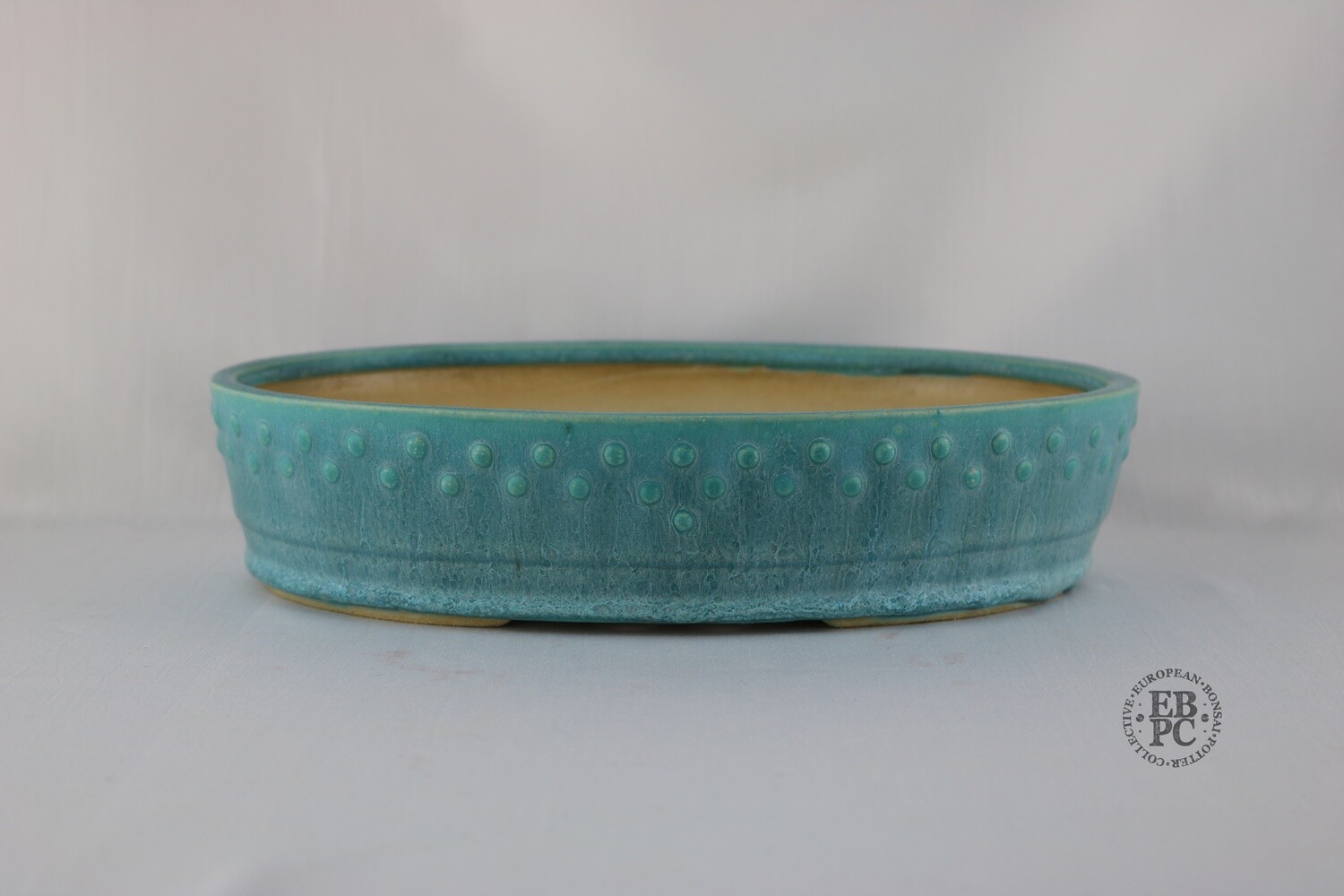 Fukurou Ceramics - Switzerland. 26.8cm; Hand-made; Oval; Elegant Design; Studded Pattern; Basal Band; Superb Turquoise Glaze; White and Blue / Green; Patrik Lüthi