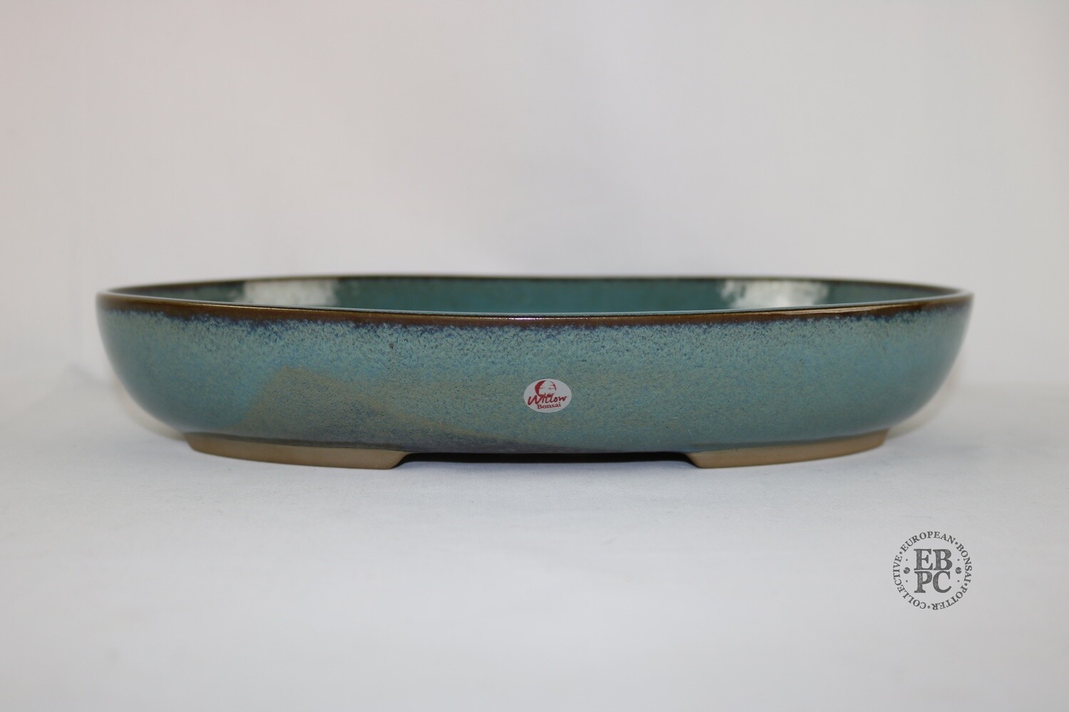 Willow Bonsai Pots. 31.2cm; Oval; Peacock Glaze; Bluish Green; Browns; Recessed Feet; Made in South Africa.
