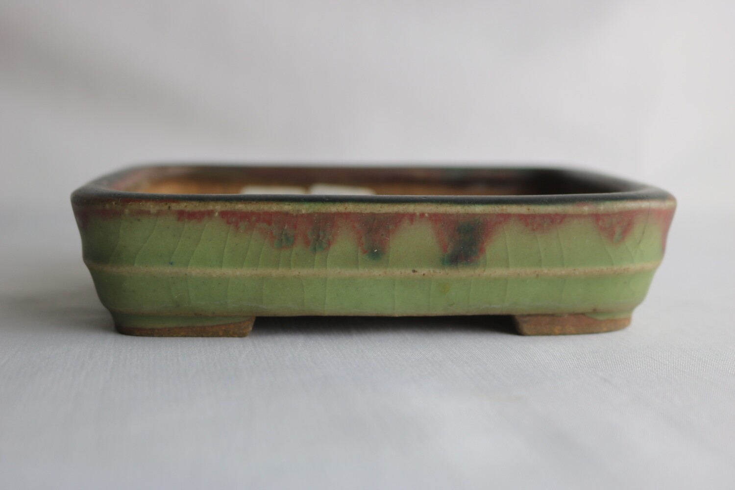 Hattori - Tokoname, Japan. 13.1cm; Rectangle; Glazed; Celadon; Green; Blood Red; Hand Signed By Artist.