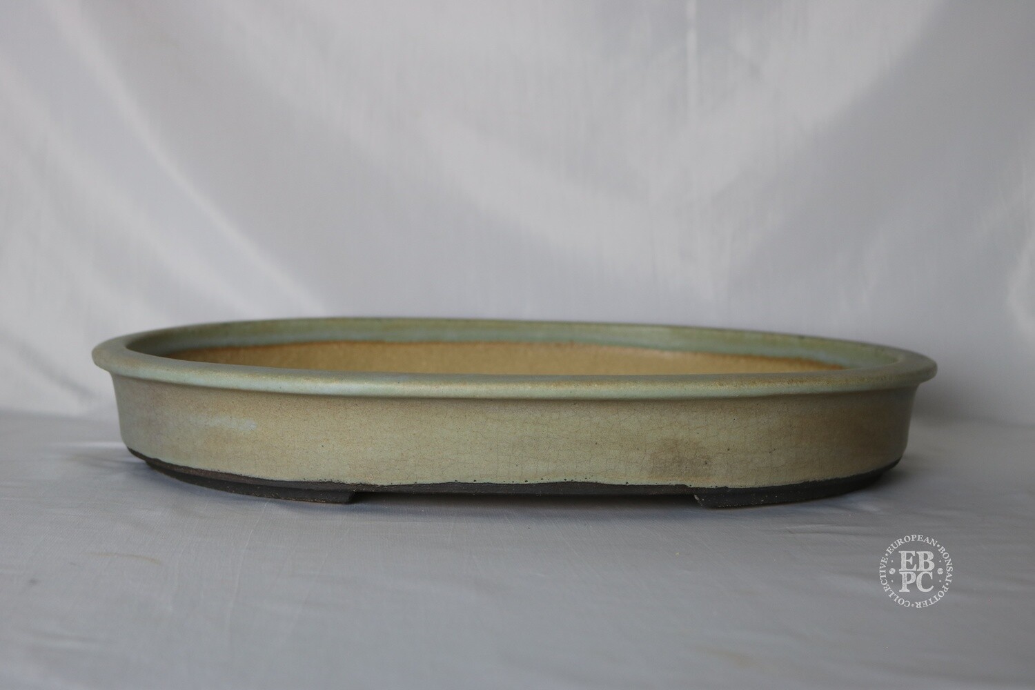 Walsall Studio Ceramics - Esther Griffiths.  42.2cm; Oval; Glazed; Crackle Glaze; Lip to Rim; Recessed Feet; Light Mint Green; Browns; Pink.