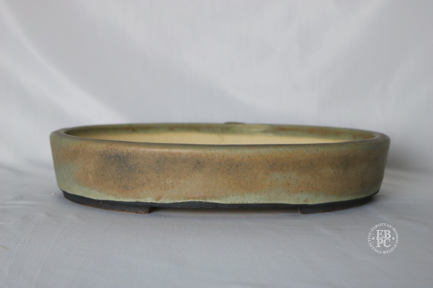 Walsall Studio Ceramics - Esther Griffiths.  33.3cm; Oval; Glazed; Crackle Glaze; Lip to Rim; Recessed Feet; Light Mint Green; Browns; Pink.
