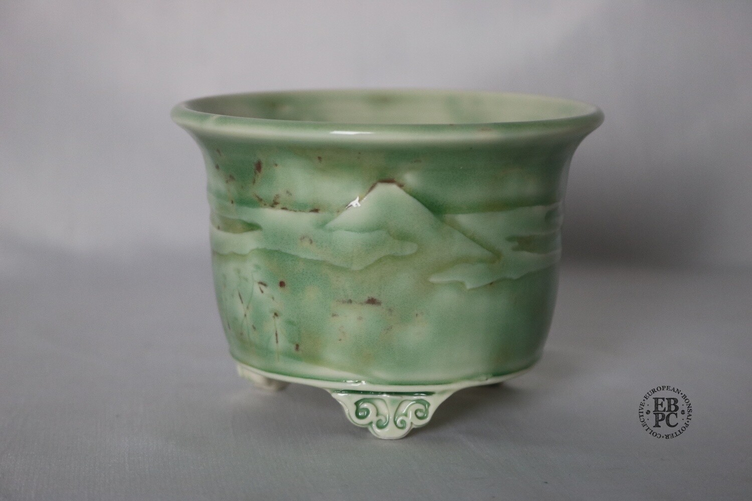 Amdouni Bonsai Pots - 10.5cm; Carved in Relief; Fuji &amp; Forest; Celadon; Glazed; Round; Sami Amdouni; EBPC Stamped.