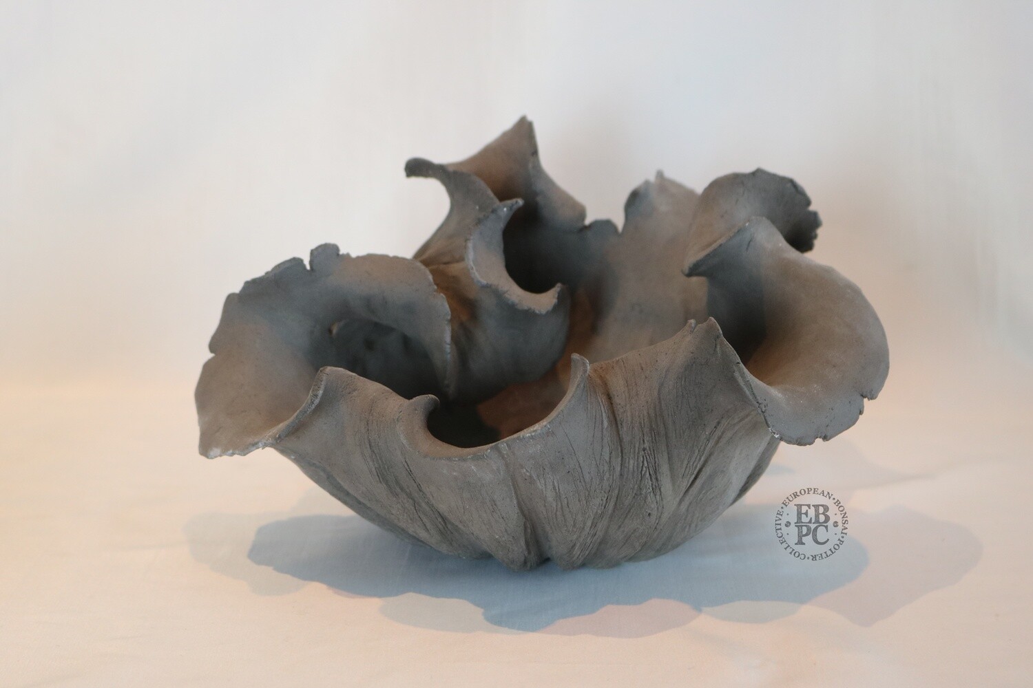 Ioannis Makris Bonsai Pots.  24cm; Freeform Bonsai Pot; Sculptural Design; Rock-like Texture; Excellent Flow; Charcoal Grey; Greece.