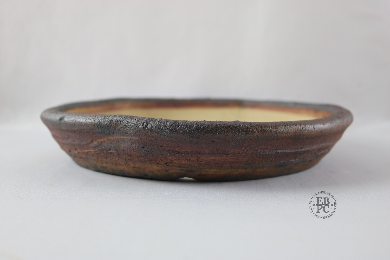 Ian Baillie - 26.2cm; Unglazed; Nanban; Oatmeal Clay; Rustic; Aged looking; Browns; Red Tones; Charcoal Grey; Hand-signed; EBPC Stamped