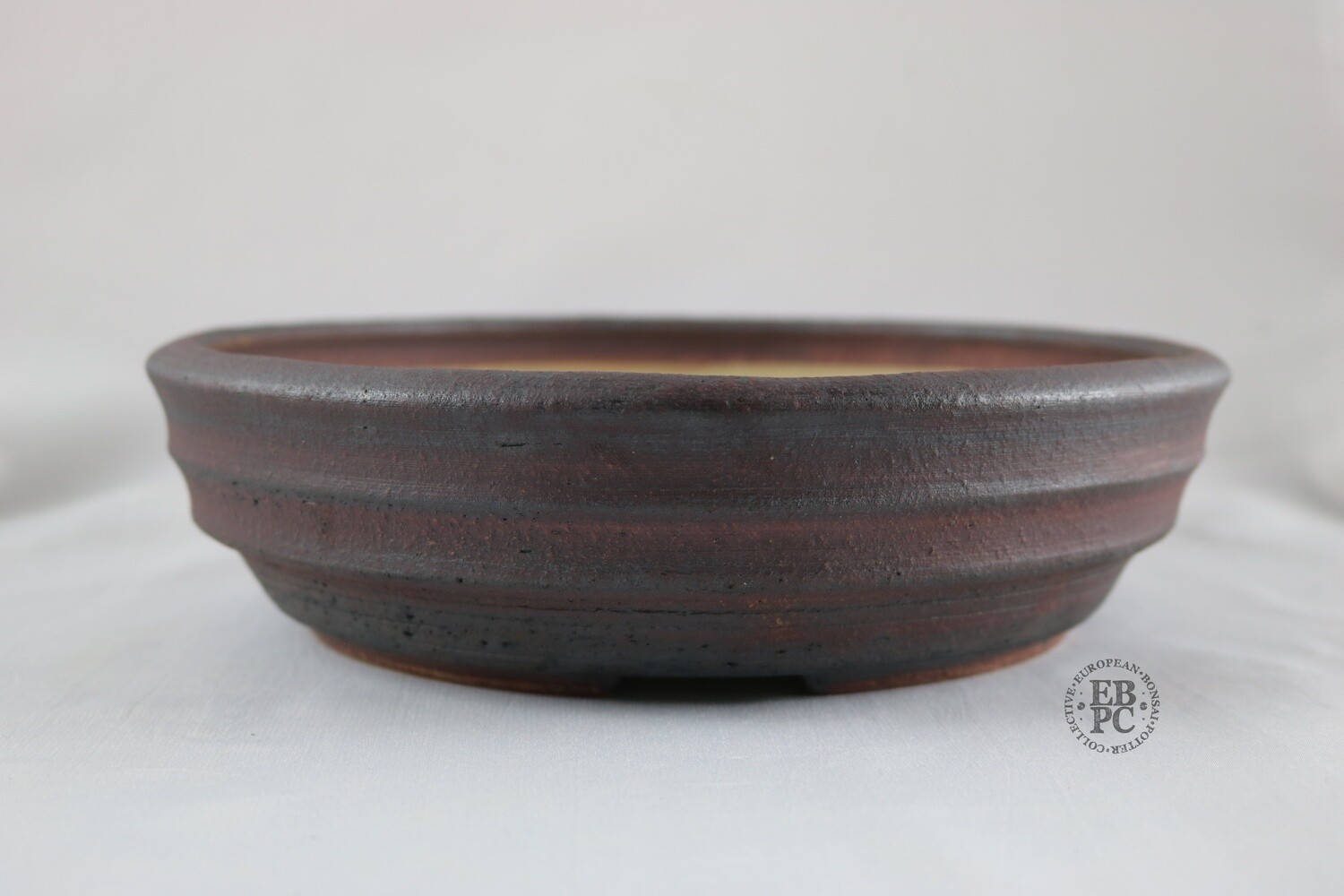 Ian Baillie - 25cm; Unglazed; Ridged Design; Generous Depth; Light Clay; Browns; Red Tones; Charcoal Grey; Rustic; Aged looking; Hand-signed; EBPC Stamped