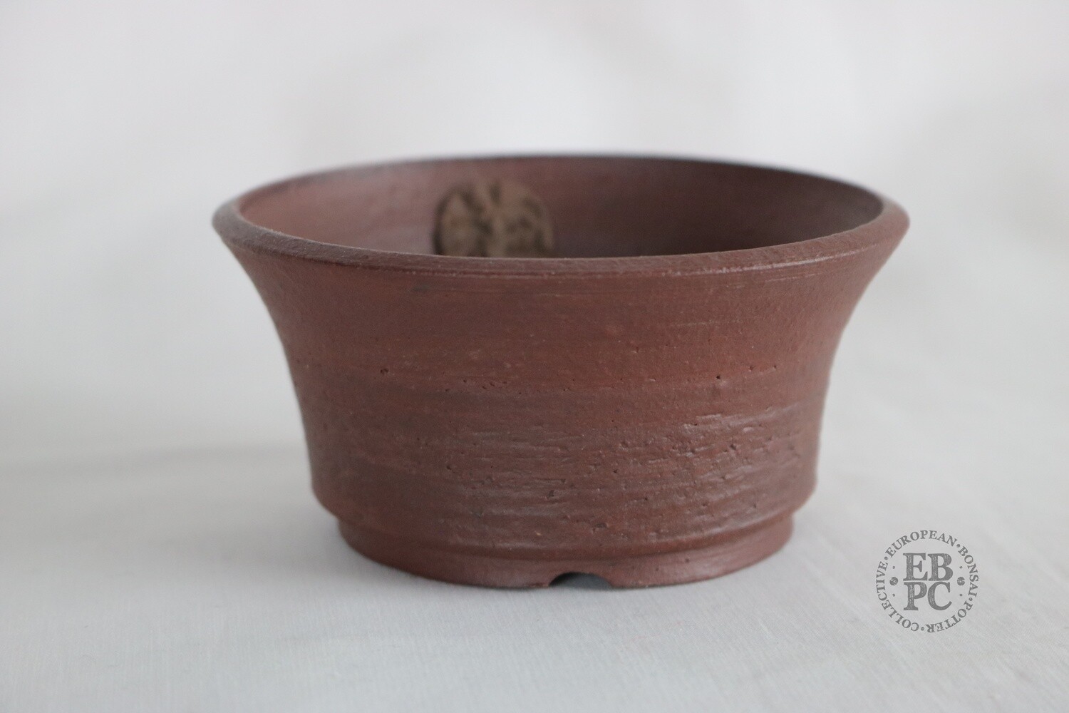 Sabine Besnard - 10.7cm; Unglazed; Round; Flared Design; Reddish Brown Finish.
