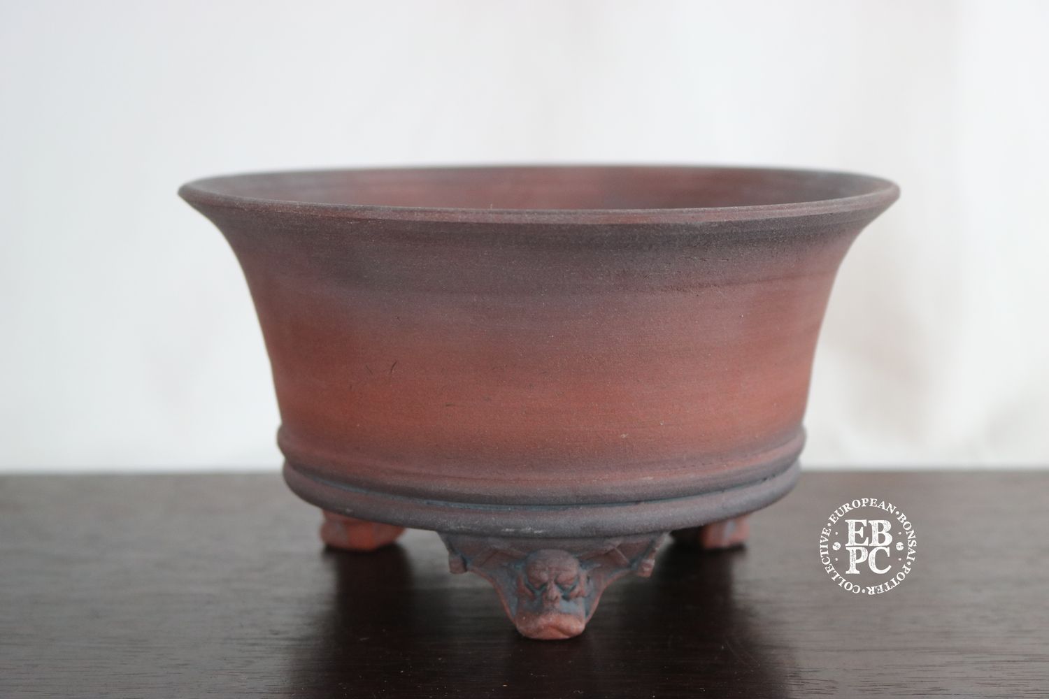 Greg Ceramics - 18cm; Round; Unglazed; Sculpted Feet; Ogre Heads: Refined Finish. EBPC Stamped.