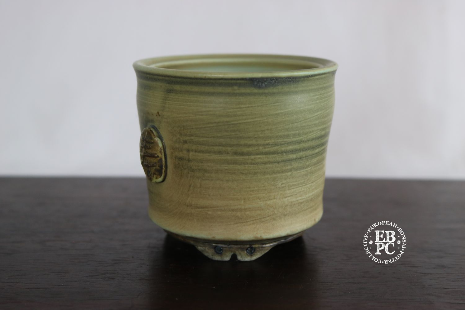EBL Pots - 8.7cm; Porcelain; Handmade; Mame/Shohin/ Accent Pot; Round; Carved &#39;春&#39; (spring) Motif; Aged Green &amp; Brown Glaze; Detailed Feet; Elsebeth Ludwigsen