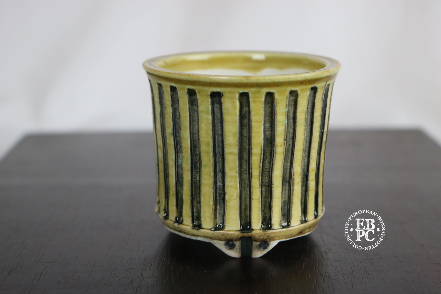EBL Pots - 7.4cm; Porcelain; Handmade; Mame/Accent Pot; Round; Carved Stripes Design; Yellow and Black Glaze; Detailed Feet; Elsebeth Ludwigsen