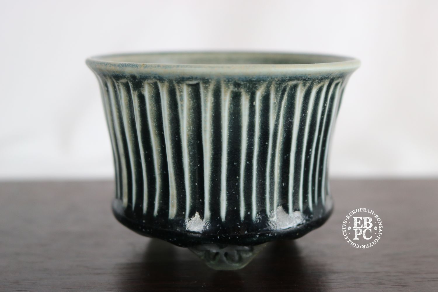 EBL Pots - 9.4cm; Porcelain; Handmade Pot; Round; Carved Stripes Design; Light &amp; Dark Green Glaze; Detailed Feet; Elsebeth Ludwigsen