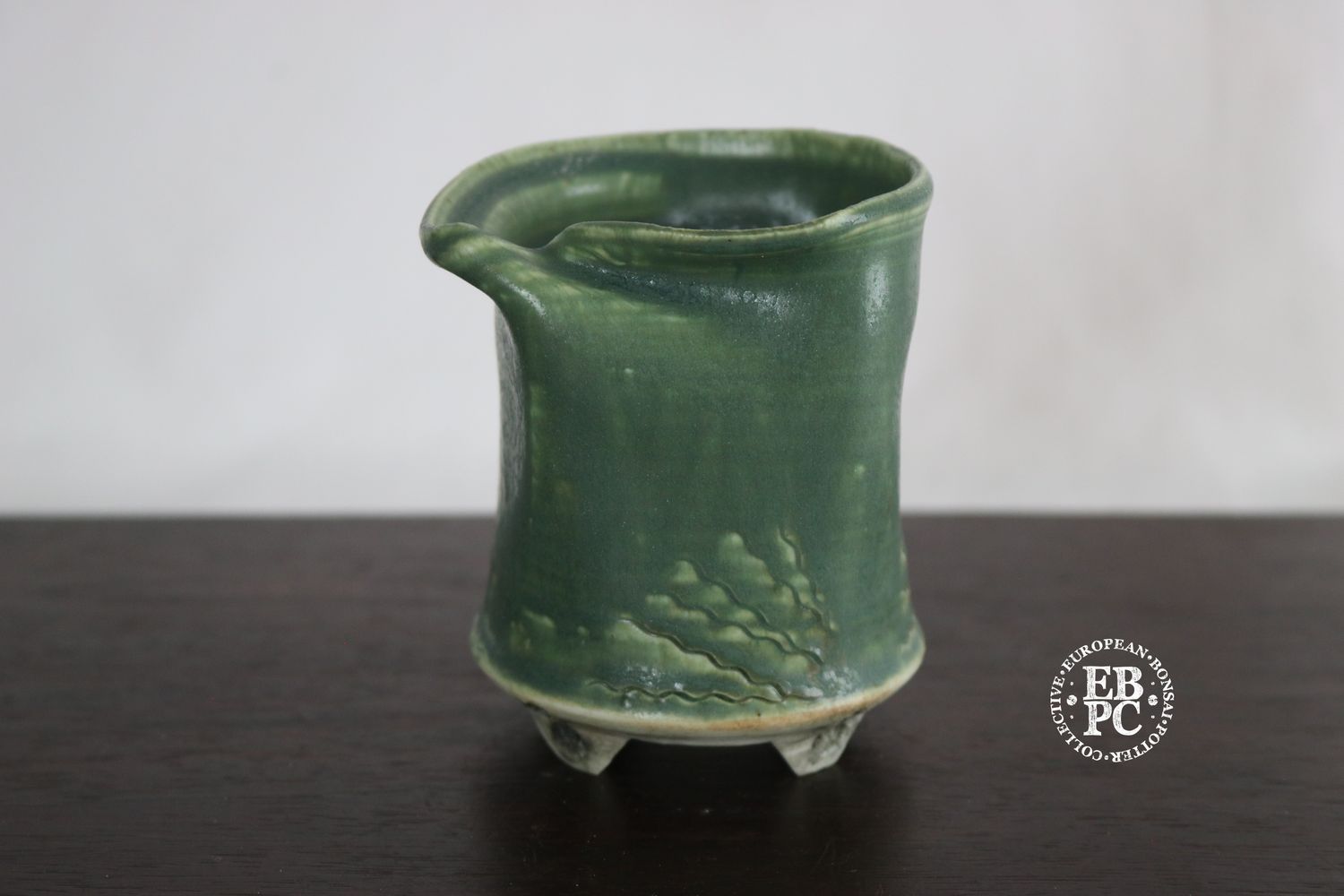 EBL Pots - 8.2cm; Porcelain; Handmade; Shohin / Accent Pot; Round; Deformed Rim; Decorative Carved Patterns; Green Glaze; Detailed Feet; Elsebeth Ludwigsen