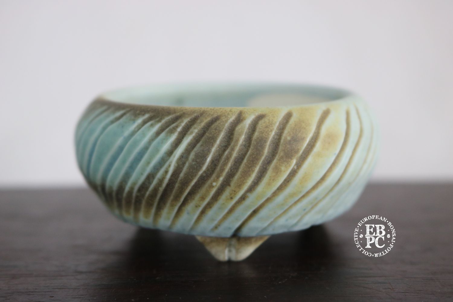 EBL Pots - 7.6cm; Porcelain; Handmade; Mame / Accent Pot; Round; Carved Stripes Design; Light Blue &amp; Brown Glaze; Volcanic Sand; Detailed Feet; Elsebeth Ludwigsen