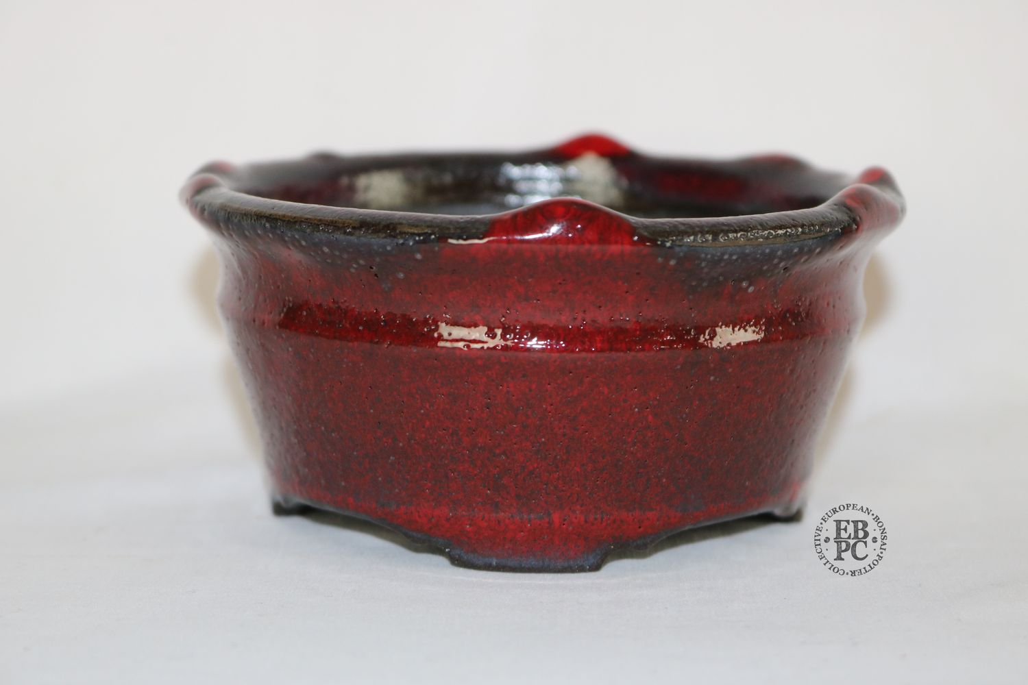Gramming Pots - 12.1cm; Glazed; Black Clay; Sang de Boeuf Red Glaze; Step Carved Feet; Upward Glaze Drips; Tomas Gramming