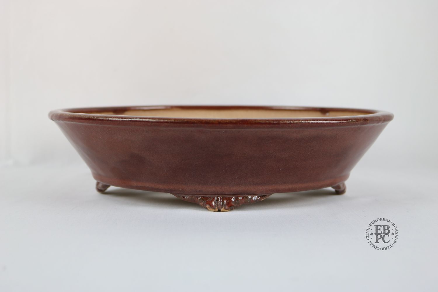 Fukurou Ceramics - Switzerland.  27.6cm; Hand-made; Oval; Formal Design; Subtle Basal Band; Cloud Feet; Satin Glaze; Sang De Boeuf; Red; Patrik Lüthi.