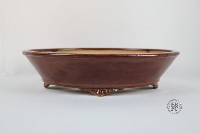 Fukurou Ceramics - Switzerland.  27.6cm; Hand-made; Oval; Formal Design; Subtle Basal Band; Cloud Feet; Satin Glaze; Sang De Boeuf; Red; Patrik Lüthi.