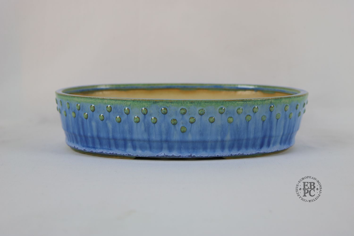 Fukurou Ceramics - Switzerland.  26.6cm; Hand-made; Oval; Elegant Design; Studded Pattern; Basal Band; Superb Drippy Glaze; Sky Blue; White; Green; Patrik Lüthi
