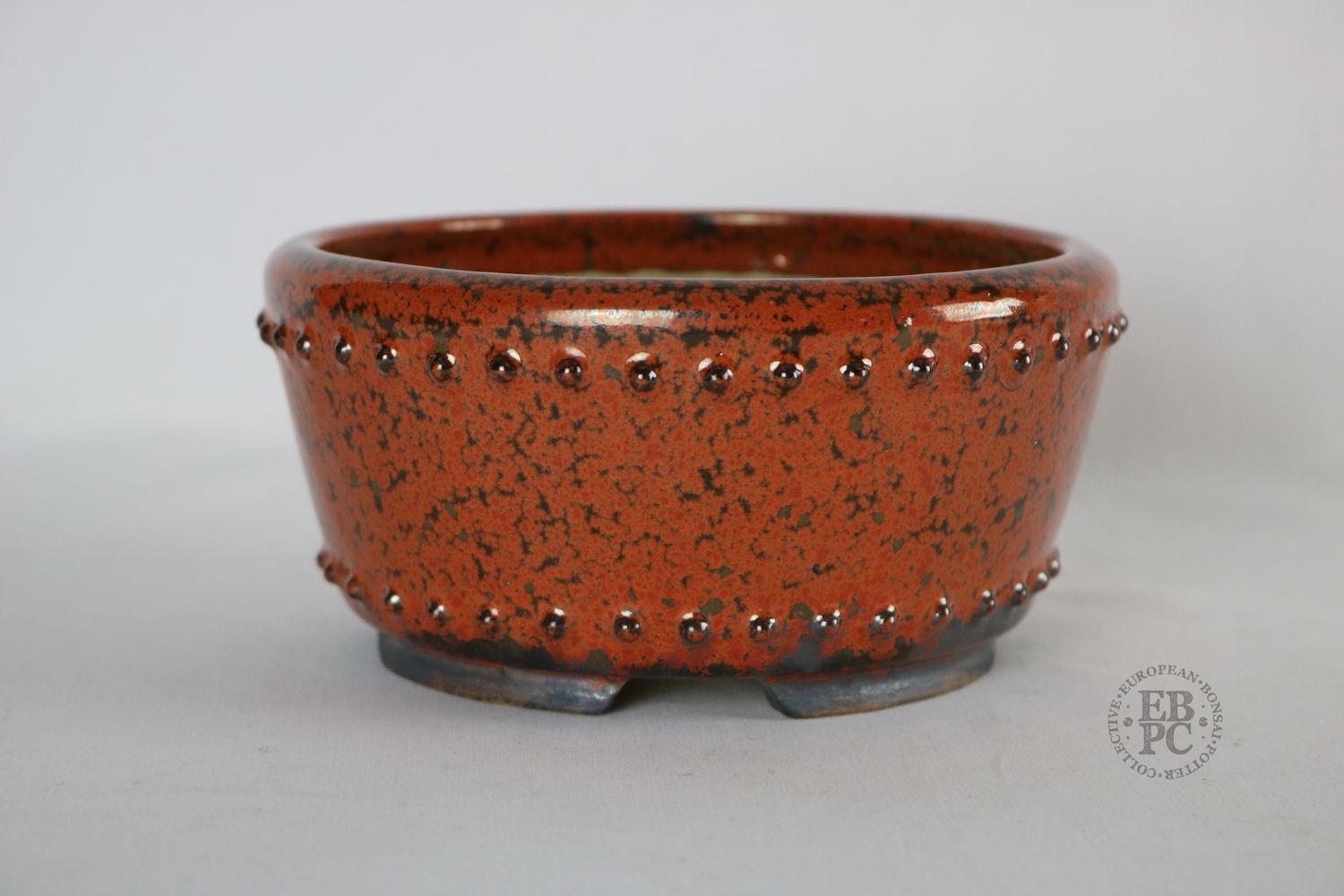 Ian Baillie.    15.6cm; Shohin +; Red Crystalline Glaze; Gunmetal/Grey; Round; Studs to Lip &amp; Base; EBPC Stamped