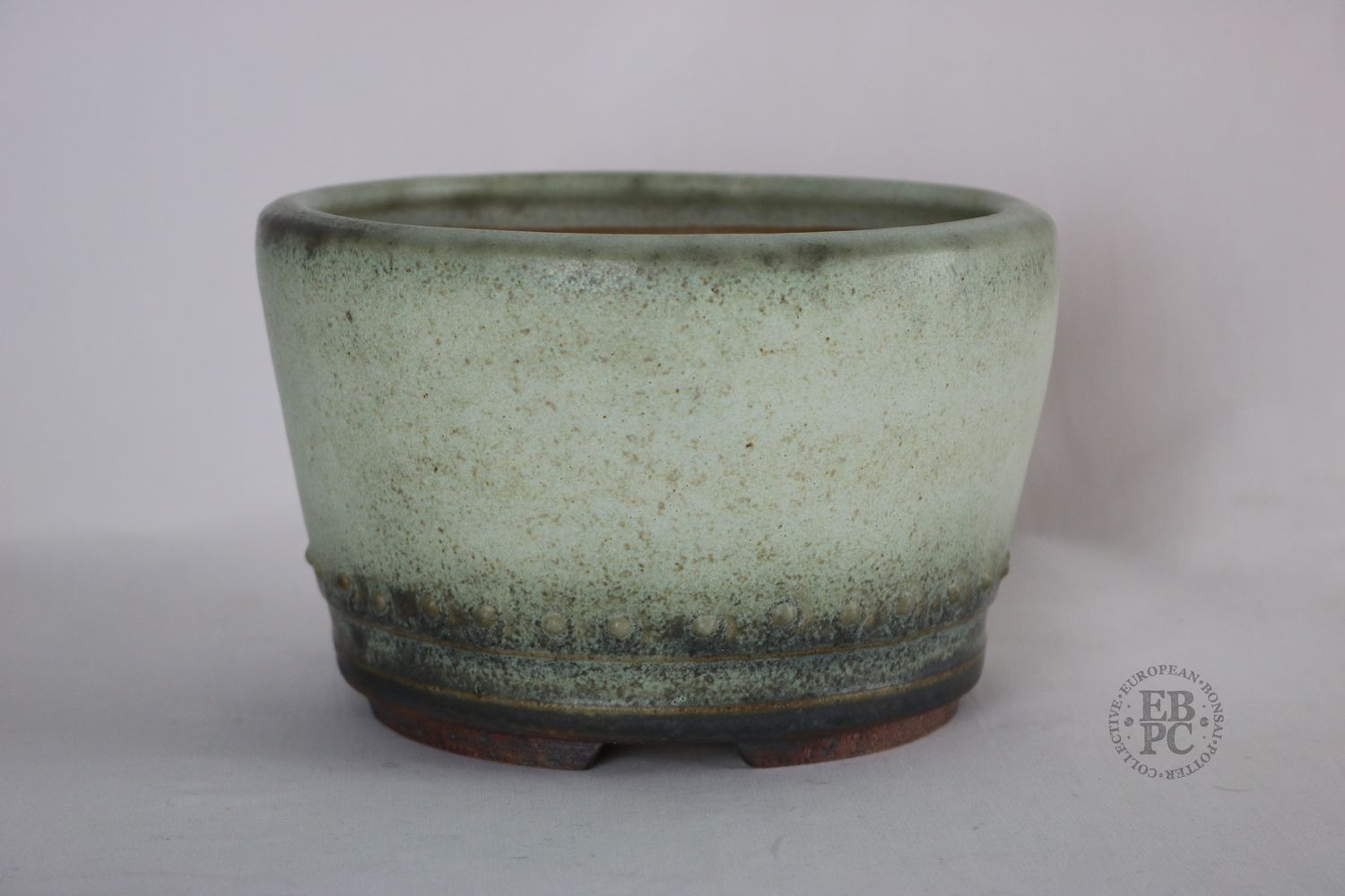 Ian Baillie - 18.2cm; Superb Glaze; Off-white; Round; Light Lichen Green; Classic Design; Recessed Feet; Hand-signed; Stamped - EBPC IB, &amp; Scotland.