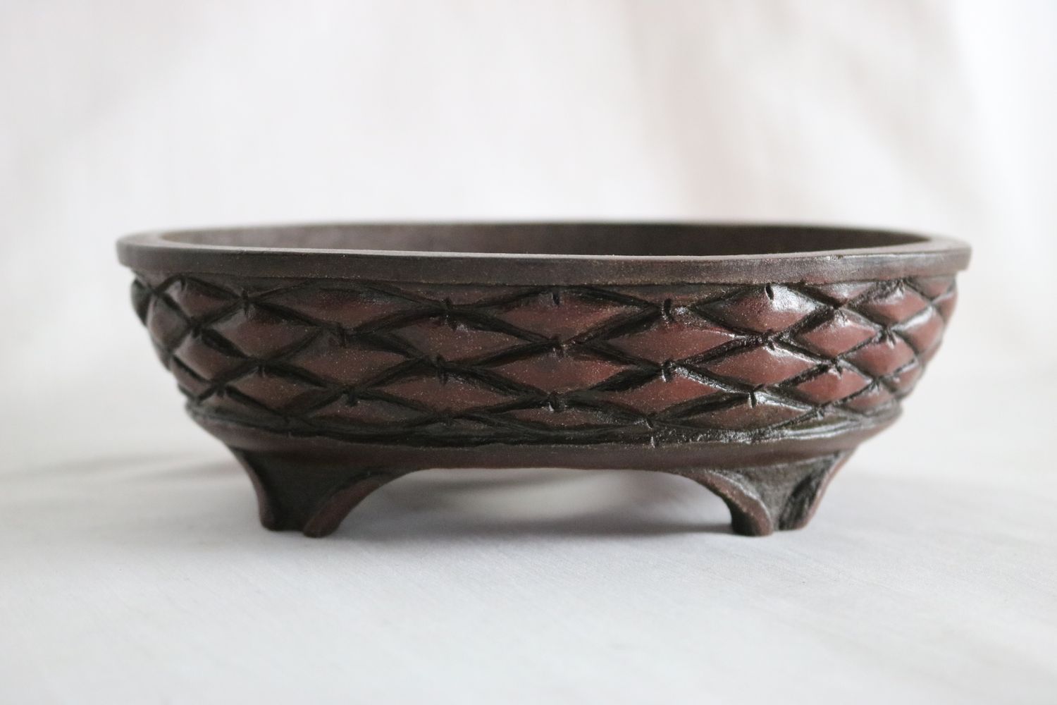 M. J. G. Ceramica - Unglazed; Oval; 16.6cm; Carved Brick/Basket Weave Design in Relief;  Polished Smooth; Reddish-Brown Clay; Maria Jose Gonzalez