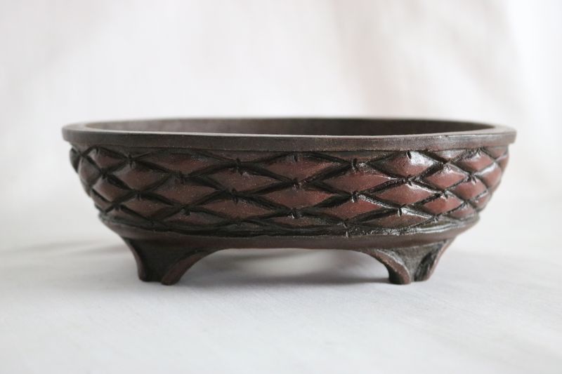 M. J. G. Ceramica - Unglazed; Oval; 16.6cm; Carved Brick/Basket Weave Design in Relief;  Polished Smooth; Reddish-Brown Clay; Maria Jose Gonzalez