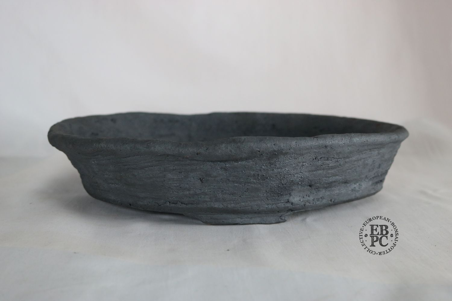 Bryan Albright - 32cm; Round; Nanban Style; Unglazed; Grey Clay; Subtle Texture.