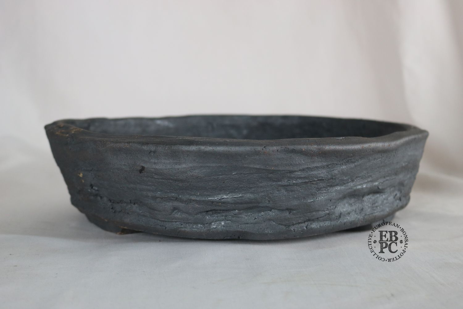 Bryan Albright - 34cm; Round; Nanban Style; Unglazed; Grey Clay; Subtle Texture.