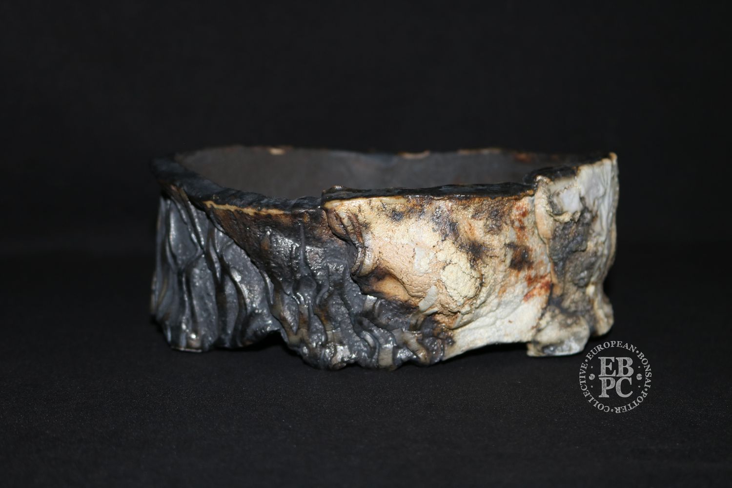 Eddie Curtis, England.   - 18cm; Unique Design Oval; Rock Effect; Shino Glaze; Multiple Glaze Techniques; Various Distinct Textures; Artist Stamped;