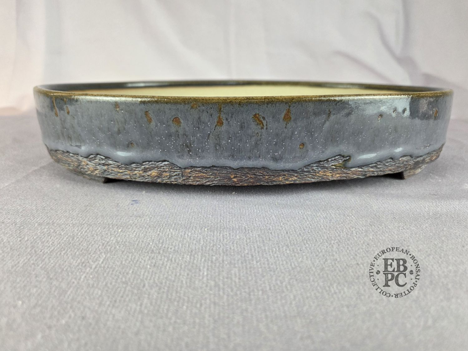 Terrajade, France.   Oval; 30.5cm; Glazed; Sumptuous Grey Glaze; Textured Base; Membership Launch Edition; EBPC Stamped