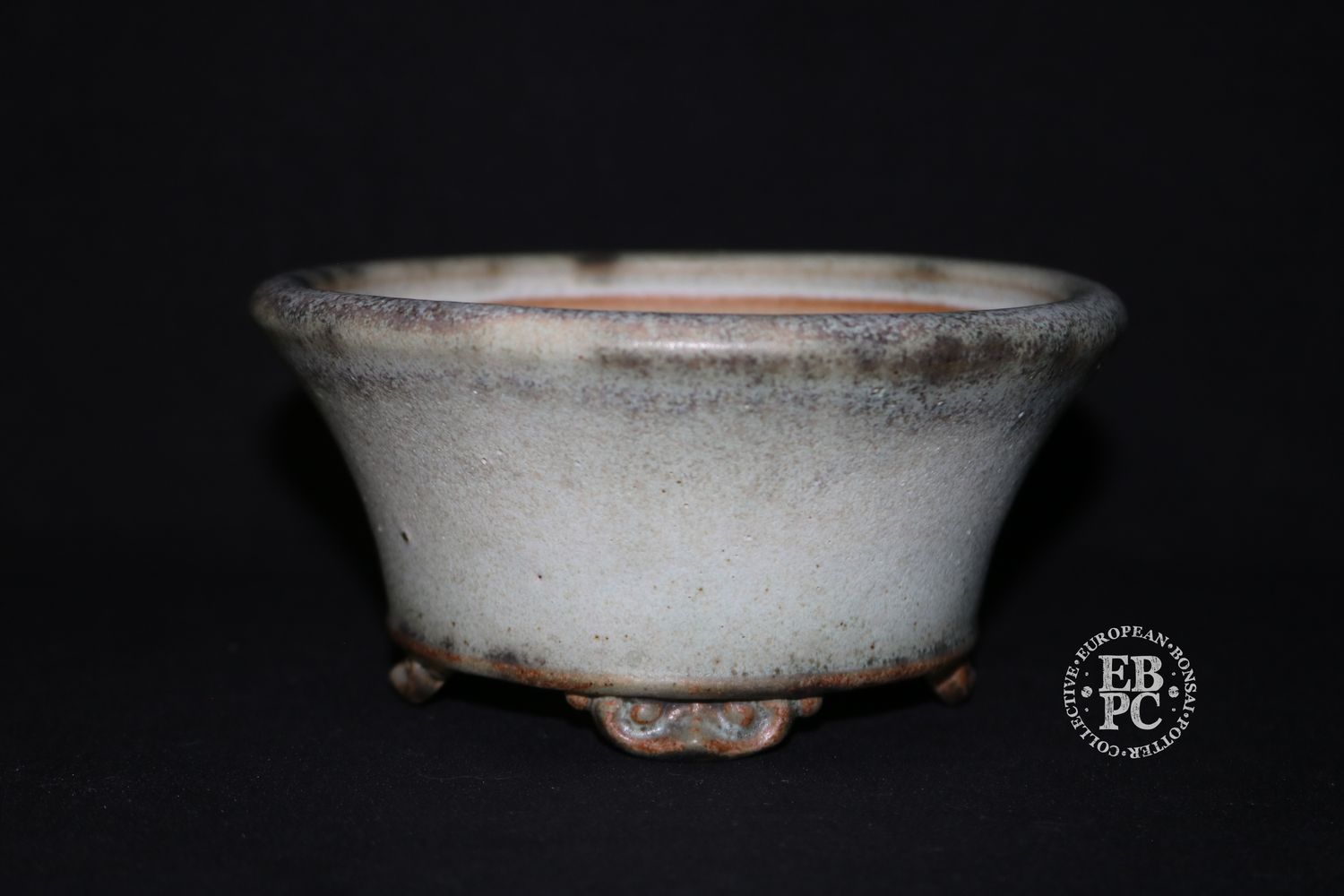 Ian Baillie - 13.2cm; Round; Flared Design; Superb Glaze; Antique White; Scroll Feet; Basal Band.        Made by Ian Baillie of Scotland.