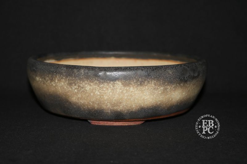 Ian Baillie - 20.3cm; Round; Traditional Design; Superb Glaze; Antique Burnt Cream; Scroll Feet; Basal Band.        Made by Ian Baillie of Scotland.