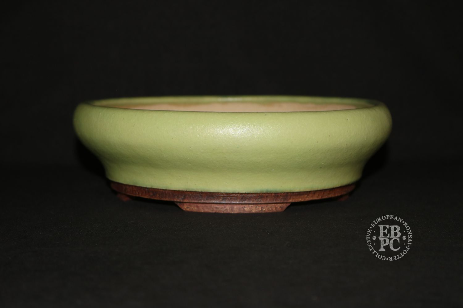 Ian Baillie - 22.2cm; Round; Elegant Design; Glazed ; Pastel Green/Yellow; Contrasting Brown Feet.     Made by Ian Baillie of Scotland.