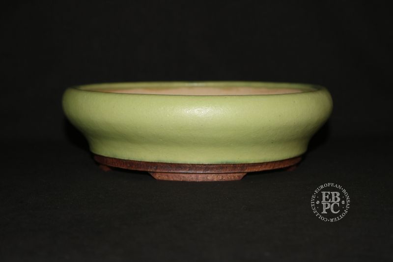 Ian Baillie - 22.2cm; Round; Elegant Design; Glazed ; Pastel Green/Yellow; Contrasting Brown Feet.     Made by Ian Baillie of Scotland.