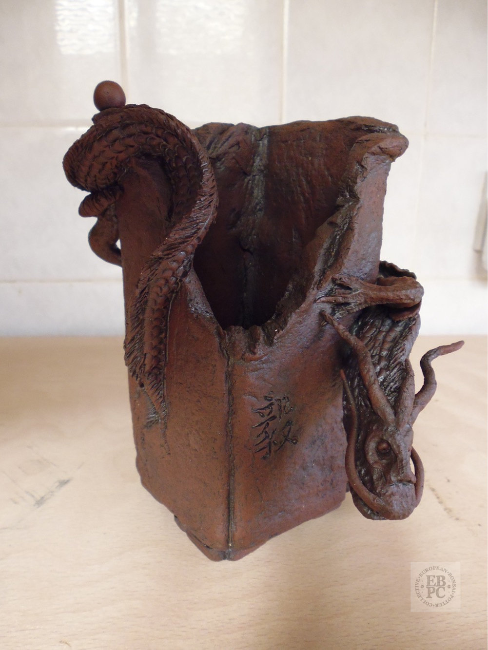 M.B. Berenbrinker - 15cm; European; kifu; cascade; unglazed; brown; dragon; carved; sculpted