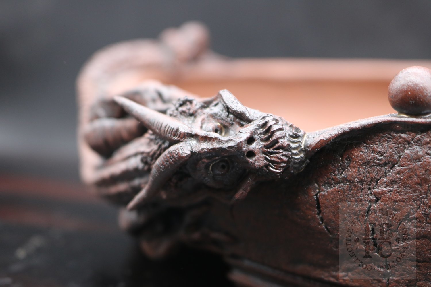 M.B. Berenbrinker - 25.1cm; European; kifu; oval; unglazed;brown; dragon; carved