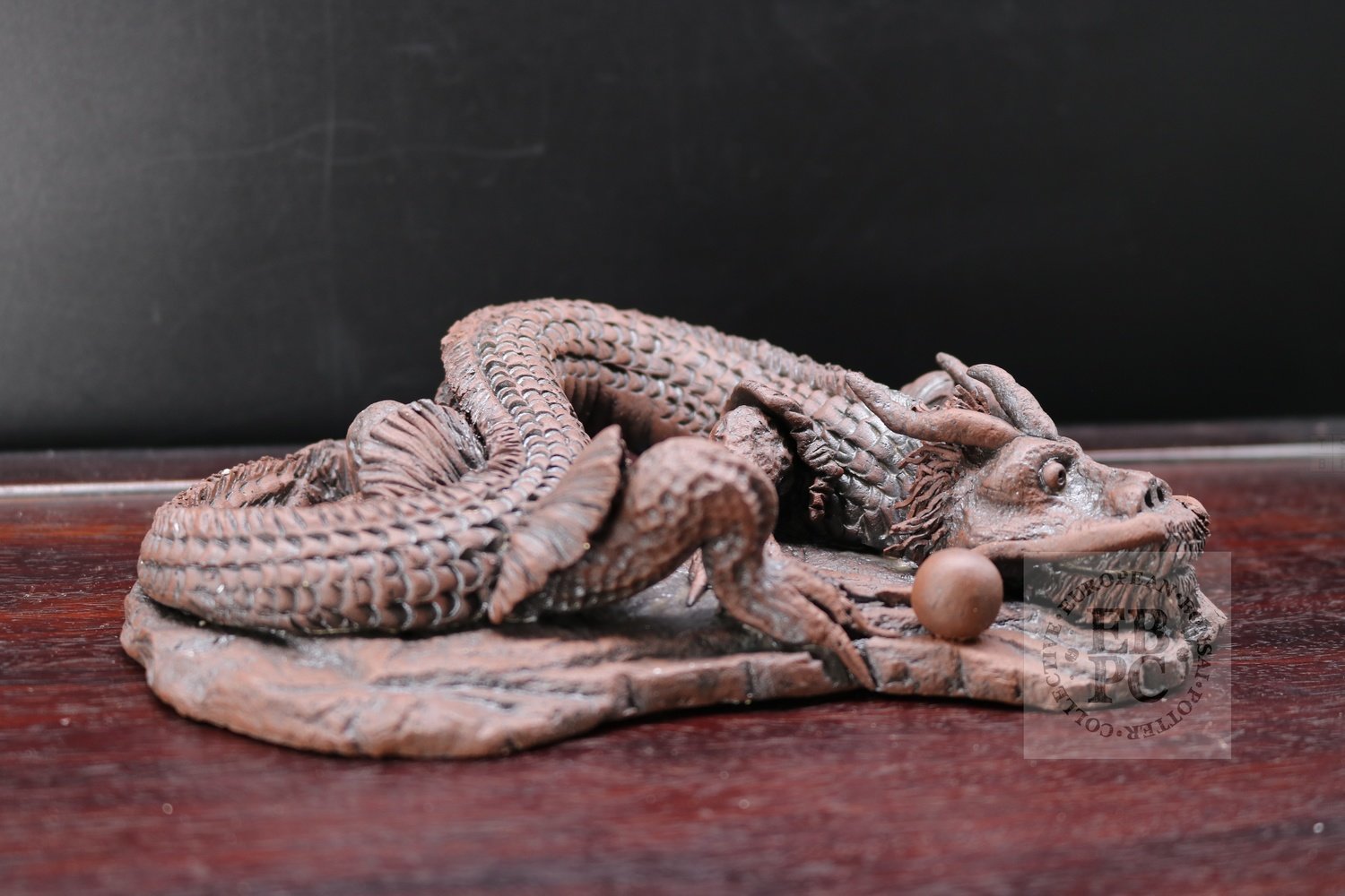 SOLD - M.B. Berenbrinker - 19cm; European; unglazed; brown; dragon; carved; Marc Berenbrinker