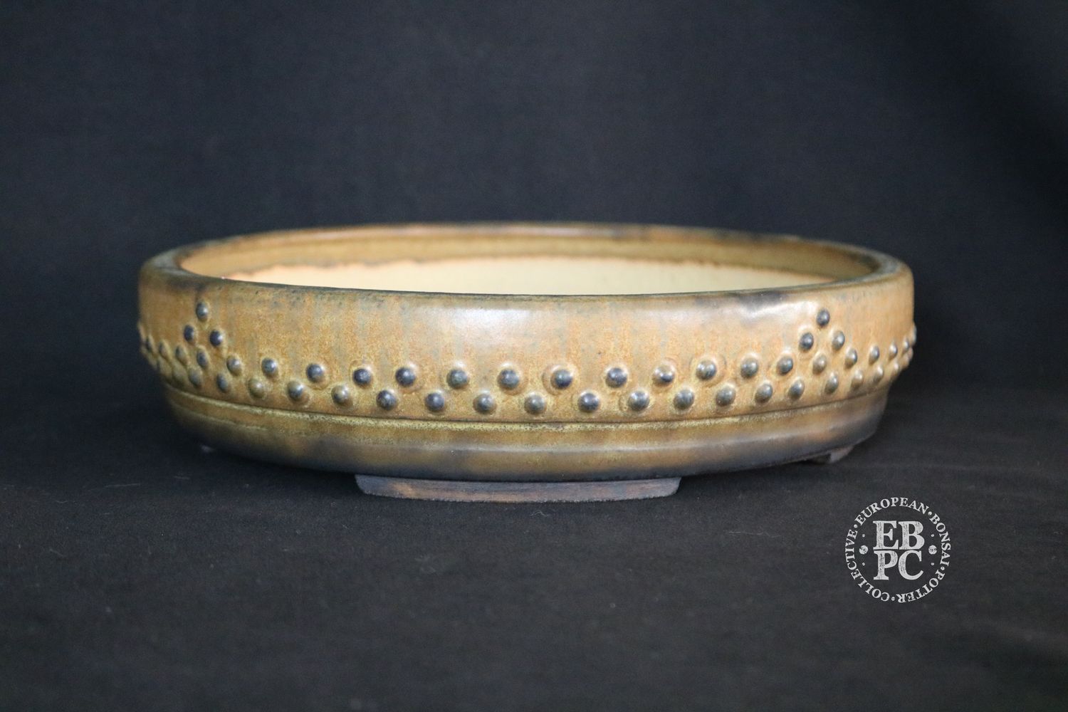 Ian Baillie - 24.2cm; Round; Drum Style; Superb Aged-looking Glaze;  Rivets/Studs; Recessed Feet; Browns;                                          Made by Ian Baillie of Scotland