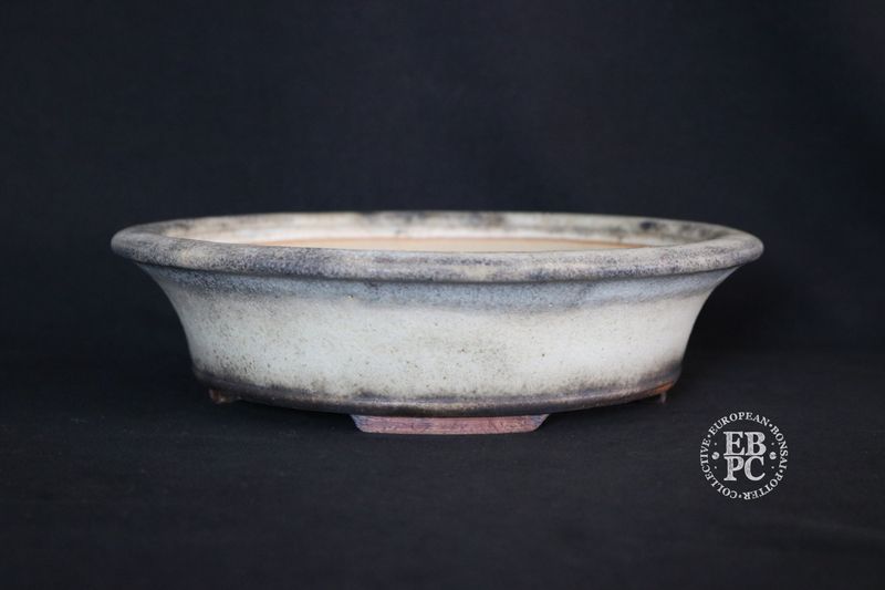Ian Baillie - 24.6cm; Round; Flared Design Superb Glaze; Cream; Browns; Recessed Feet; Basal Band.                                          Made by Ian Baillie of Scotland.