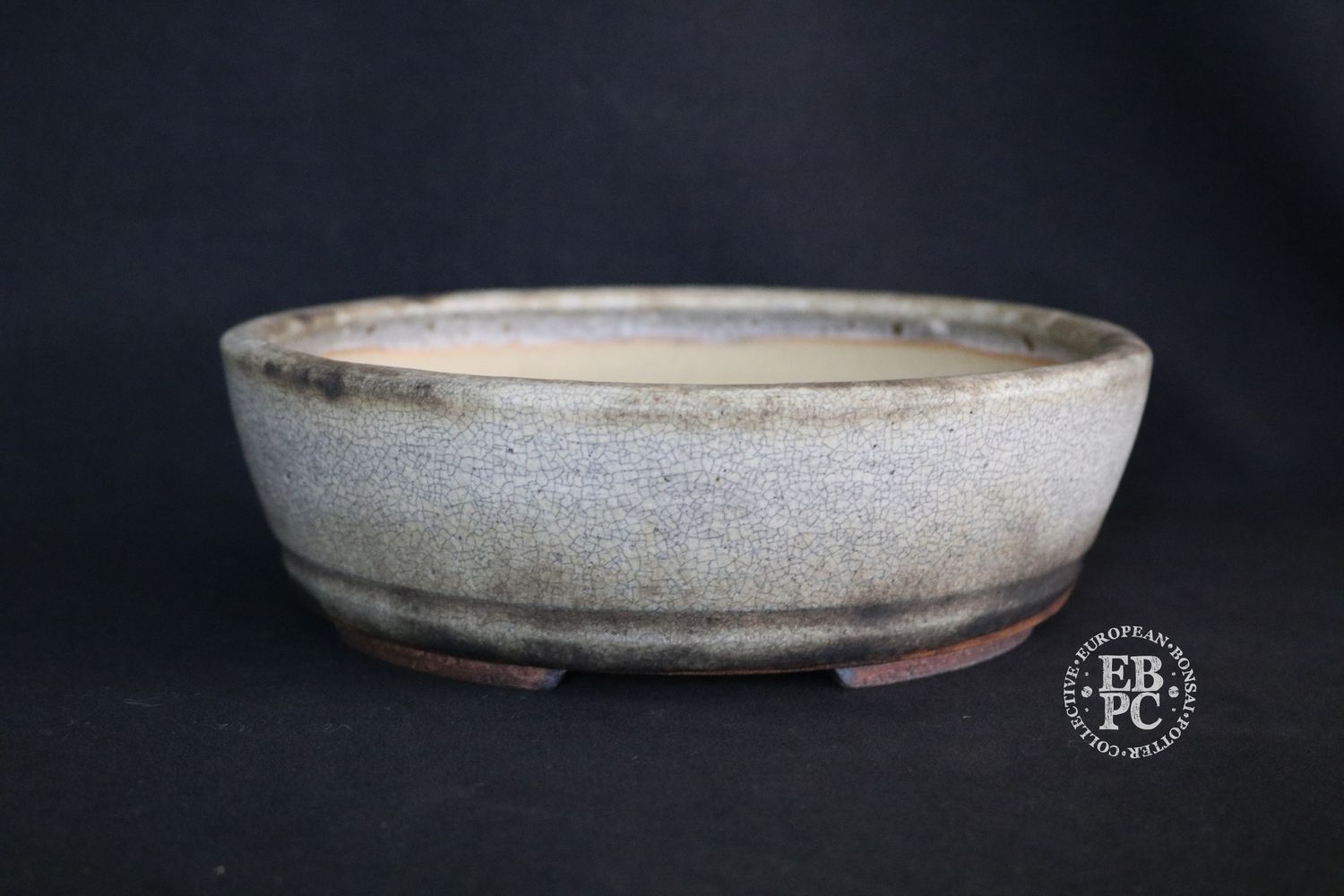 Ian Baillie - 22.5cm; Round; Elegant Design; Superb Glaze; White; Browns; Charcoal; Scroll Feet; Basal Band.                   Made by Ian Baillie of Scotland.