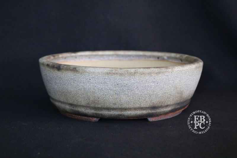 Ian Baillie - 22.5cm; Round; Elegant Design; Superb Glaze; White; Browns; Charcoal; Scroll Feet; Basal Band.                   Made by Ian Baillie of Scotland.