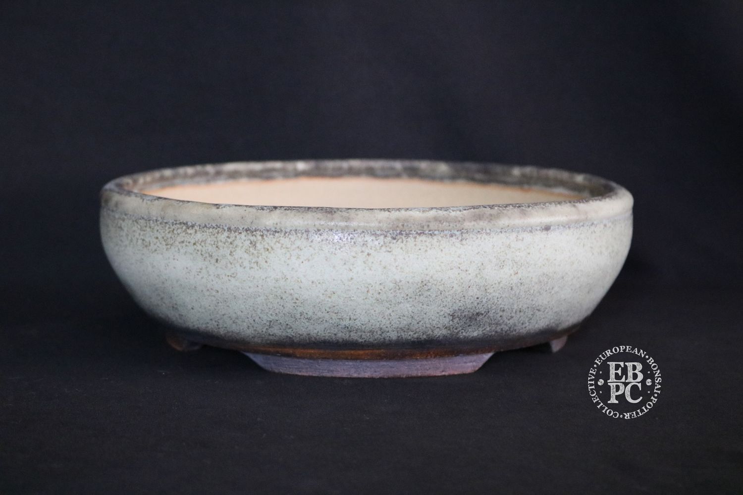 Ian Baillie - 25.6cm; Round; Elegant Design; Superb Glaze; White; Browns; Charcoal; Recessed Feet;                                 Made by Ian Baillie of Scotland.