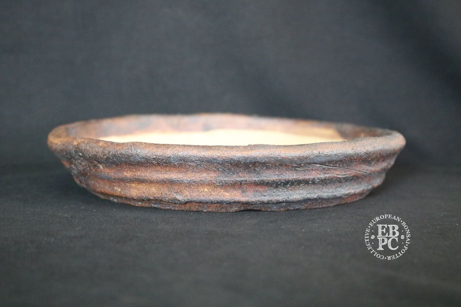 Ian Baillie - 22.2cm; Unglazed; Nanban; Oatmeal Clay; Rustic; Aged looking; Browns; Red Tones; Charcoal Grey; Hand-signed; EBPC Stamped