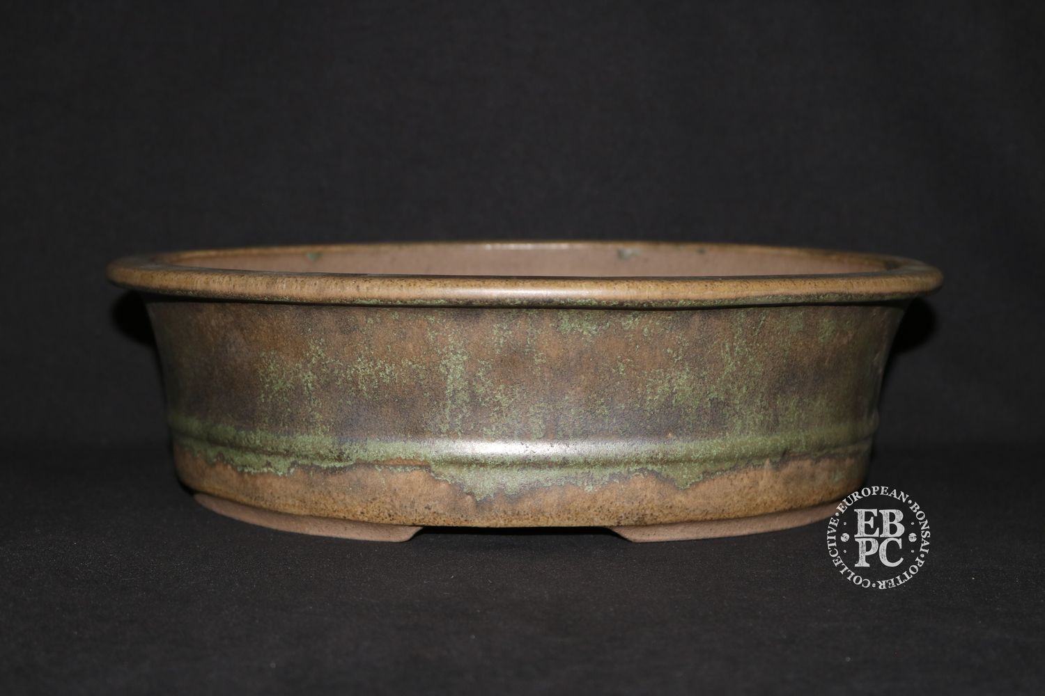 Peter Krebs, Germany.     - 2018 made -    32cm; Deeper Oval; Running Glaze; Greens &amp; Browns; Stamped By Artist.
