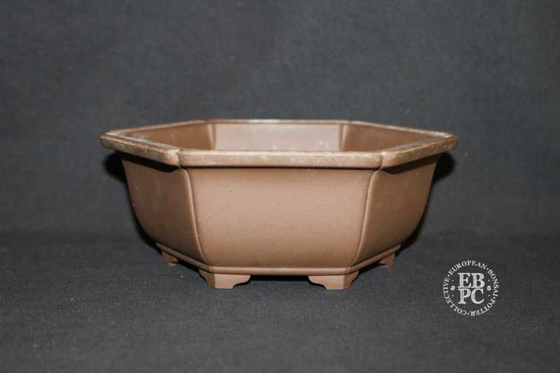 Sankyou, Tokoname, Japan.     18.8cm; Unglazed; Hexagon; Semi-Cascade; Incised Corners;  Stamped.