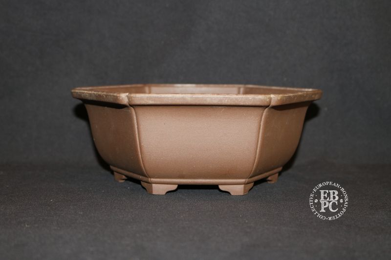 Sankyou, Tokoname, Japan.     18.8cm; Unglazed; Hexagon; Semi-Cascade; Incised Corners;  Stamped.