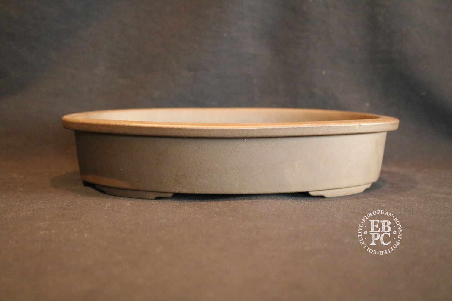 Sankyou, Tokoname, Japan.     25cm; Unglazed; Oval; Stamped.